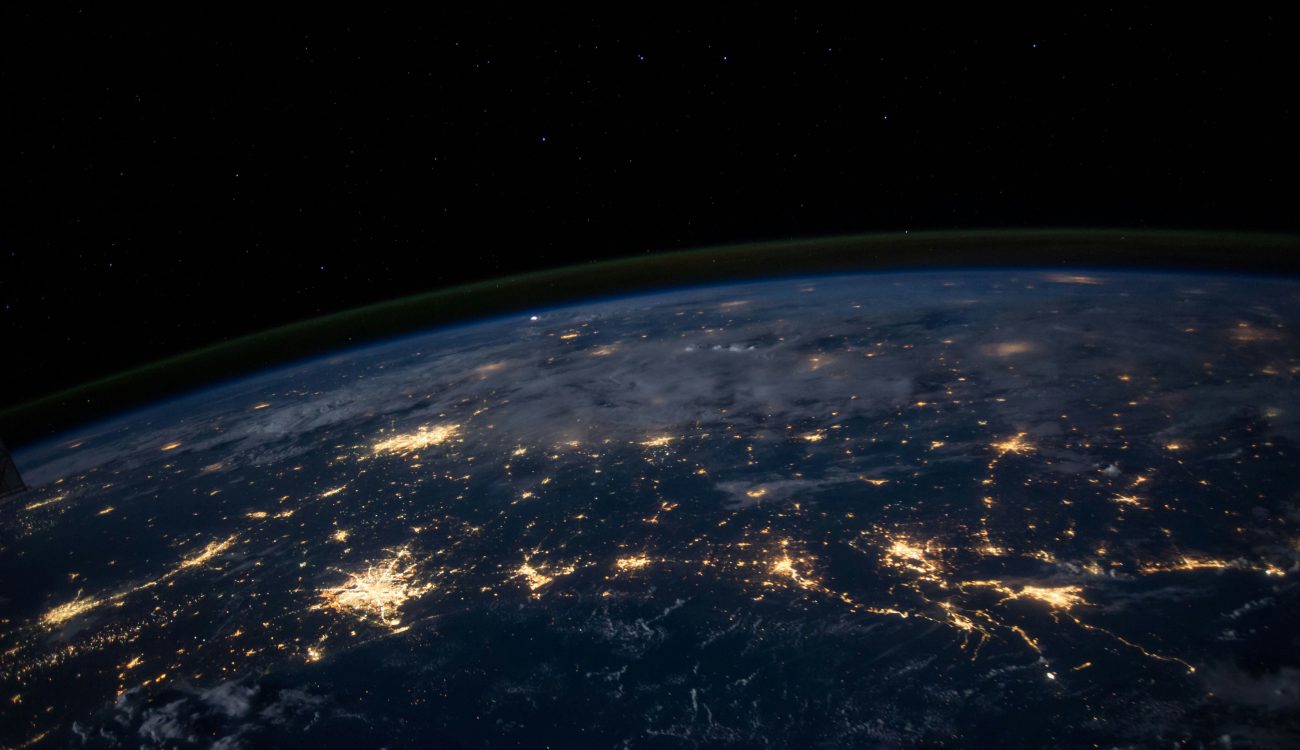 Earth at night from space, representing global digital transformation and connectivity